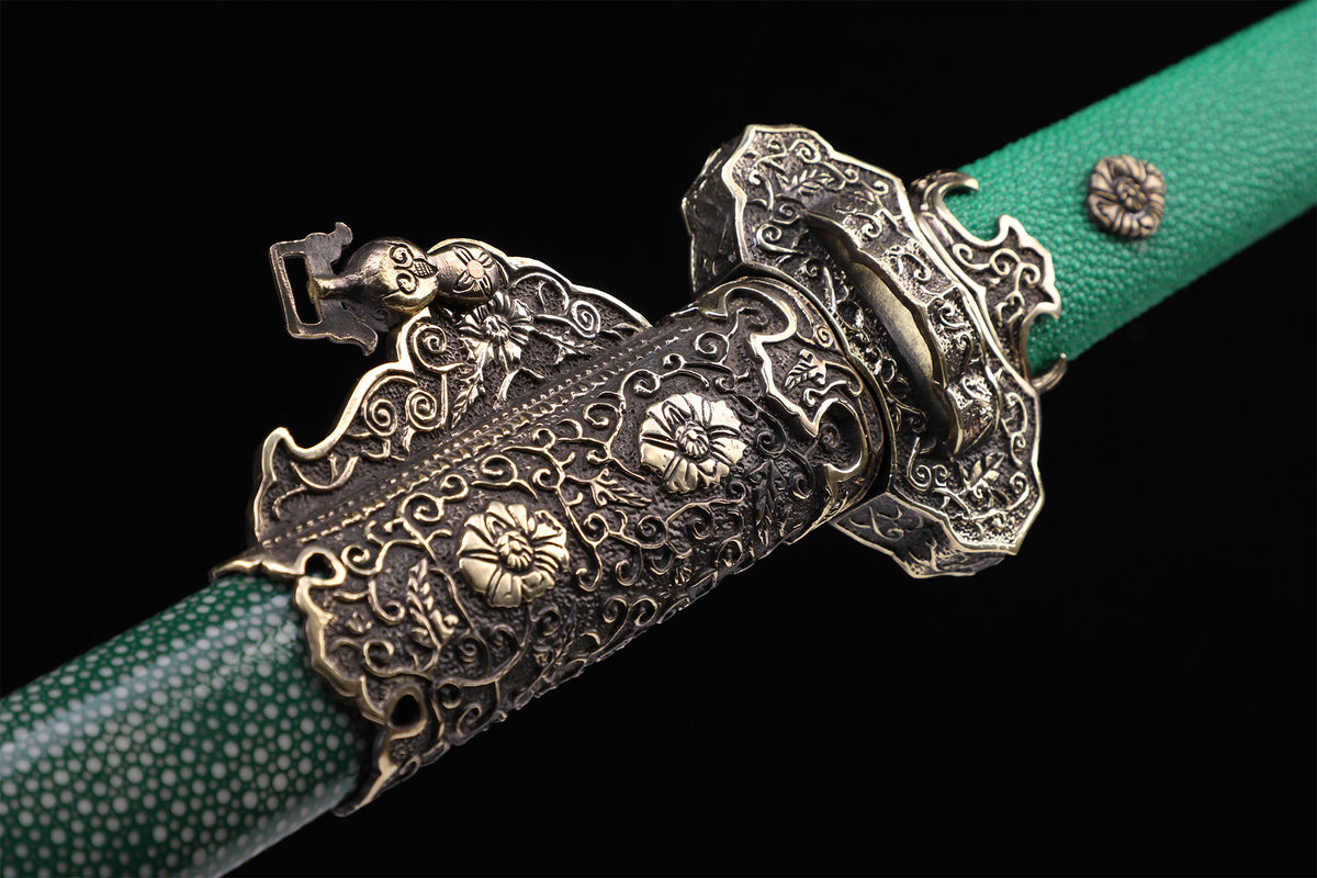Emerald green genuine ray skin vintage engraved copper Tang straight sword guard close-up - vintage engraved copper guard