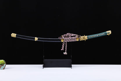 Green handle hand forged katana saya close-up - scabbard and koiguchi detail