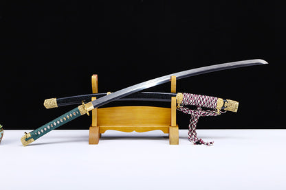 Green handle hand forged katana angled view - blade curvature and hand forged finish