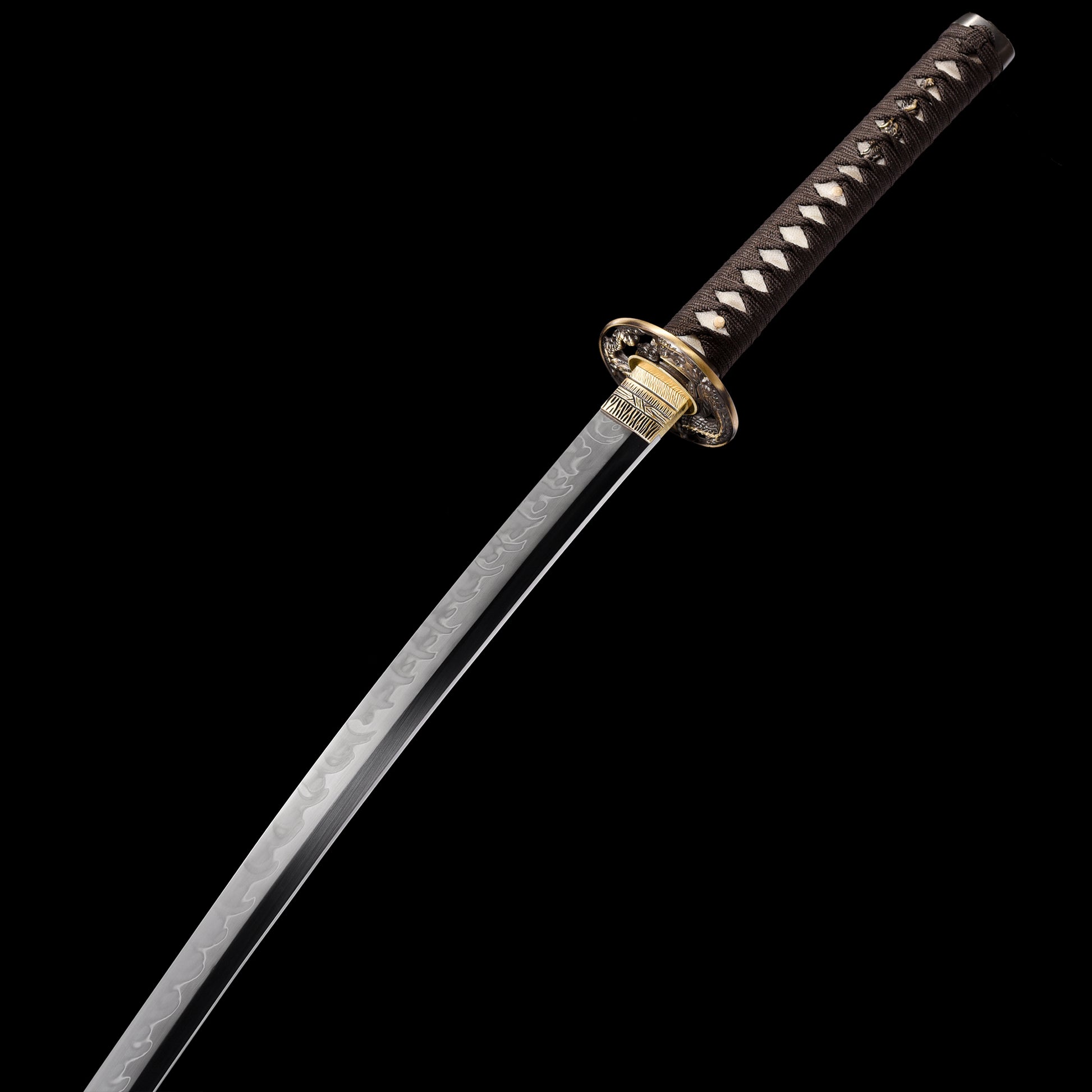 T10 steel katana blade close-up - razor sharp edge and clay tempered hamon detail