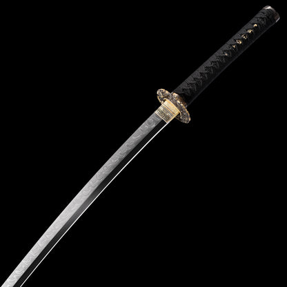 T10 steel katana blade close-up - razor sharp edge and clay tempered hamon detail