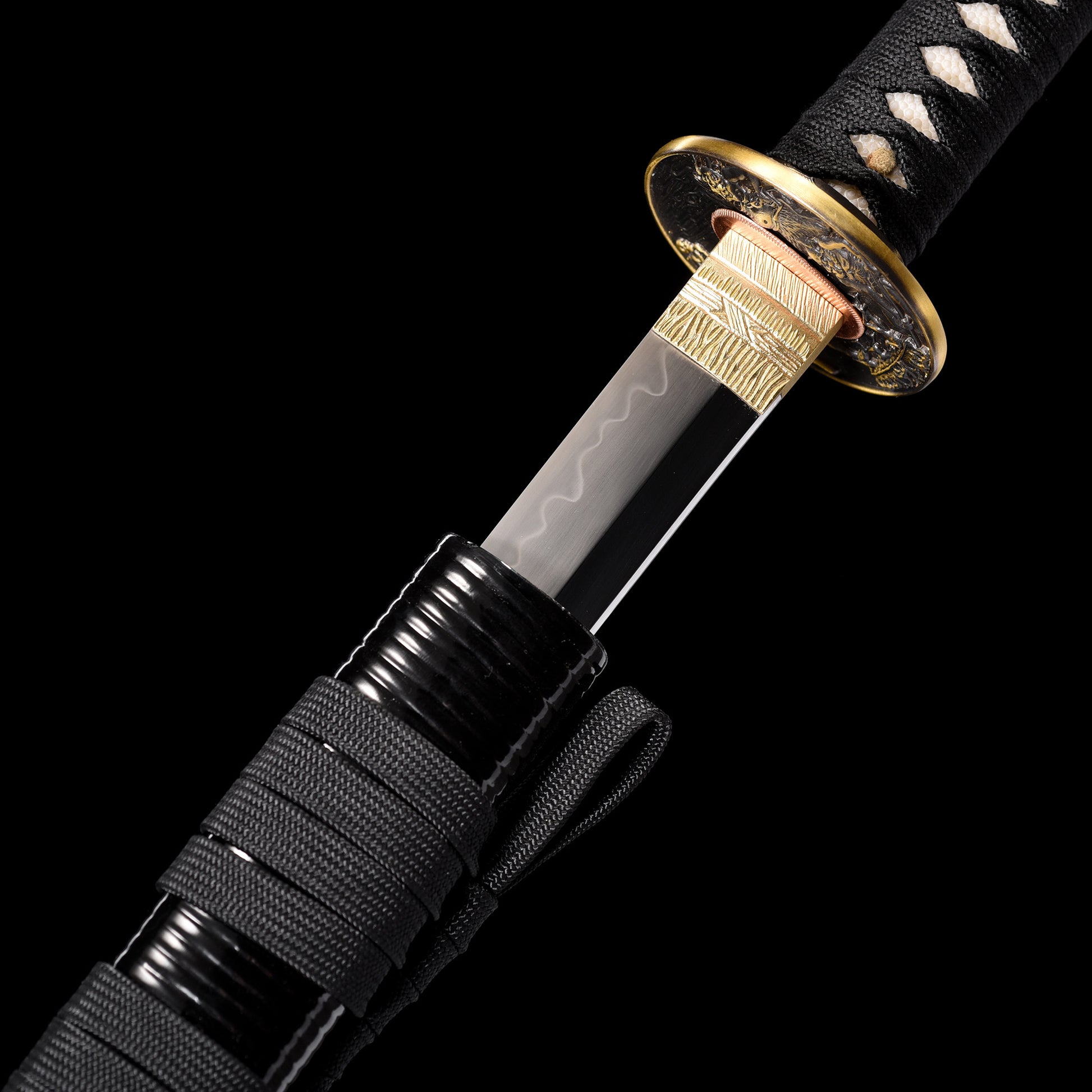 T10 steel katana hamon close-up - clay tempered wavy temper line detail