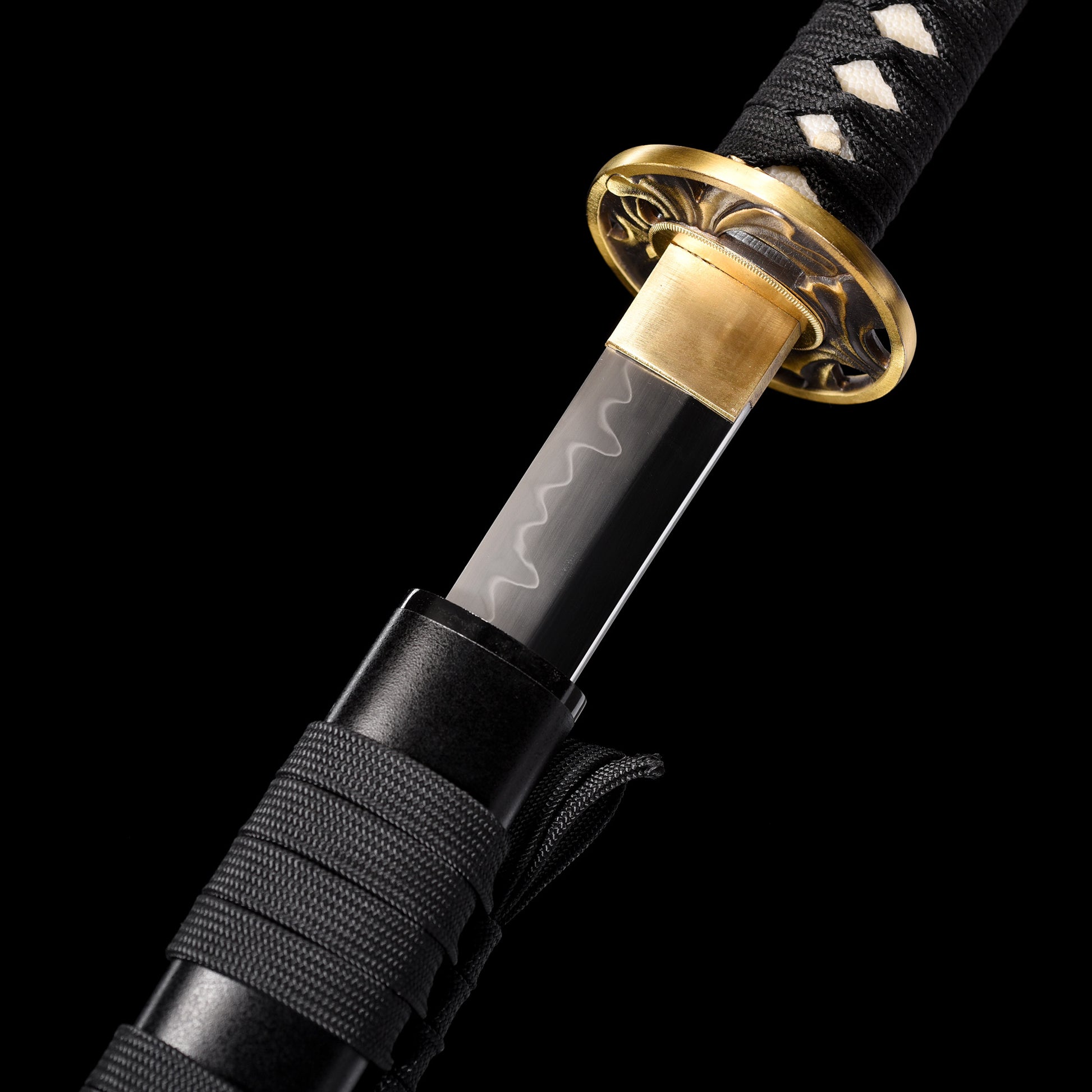 T10 steel katana blade close-up - razor sharp edge and clay tempered hamon detail