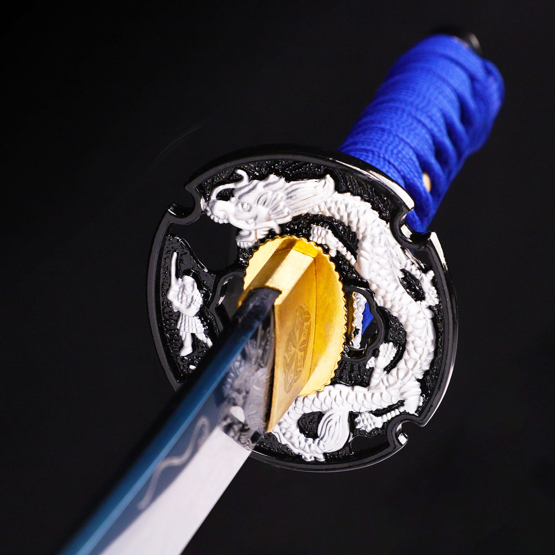 Blue blade dragon etching tanto tsuba close-up - dragon motif hand guard detail