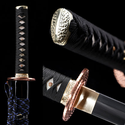 Katana handle close-up - tsuka wrap with hammered copper fuchi and kashira
