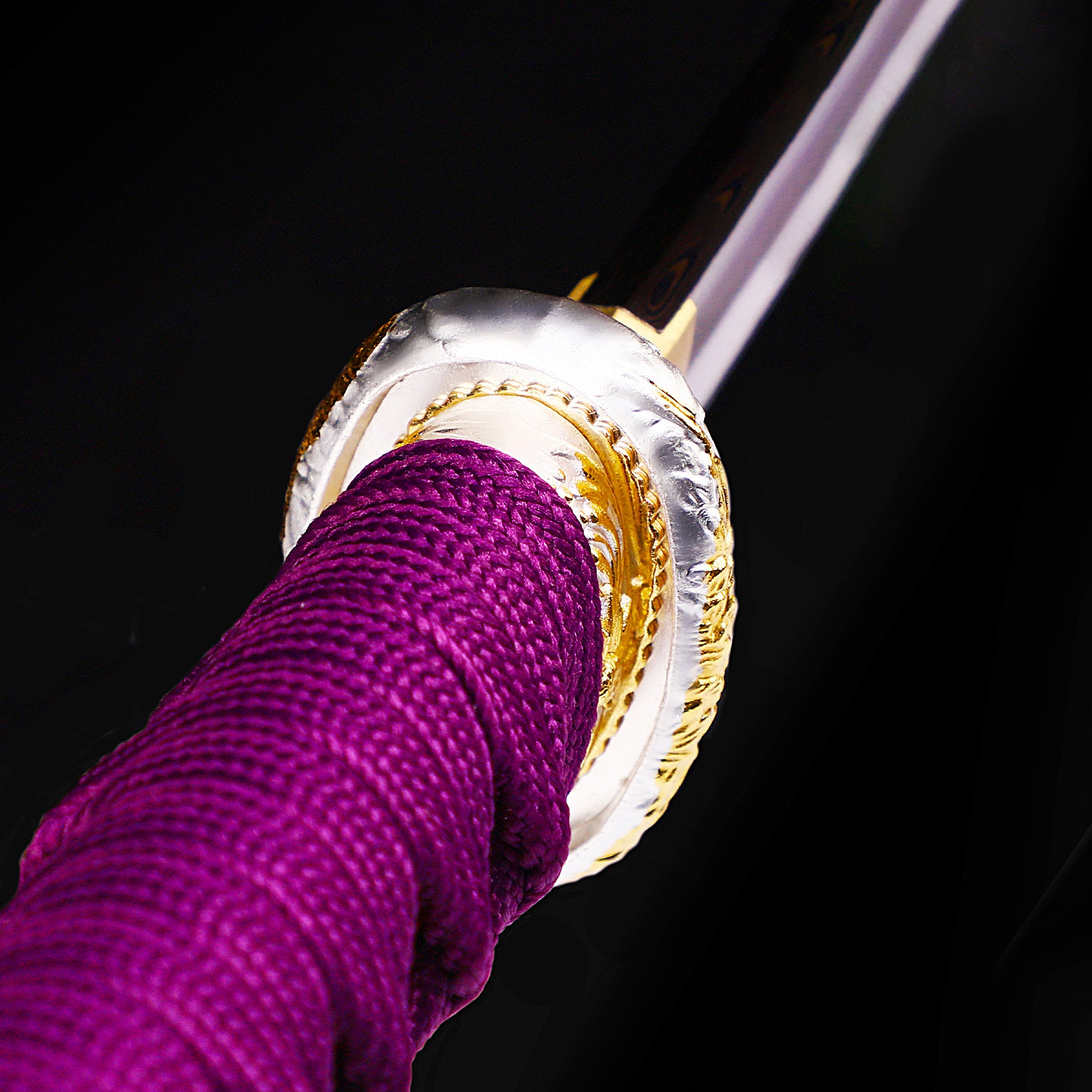 Purple marbled saya tanto handle close-up - tsuka wrap and fuchi detail