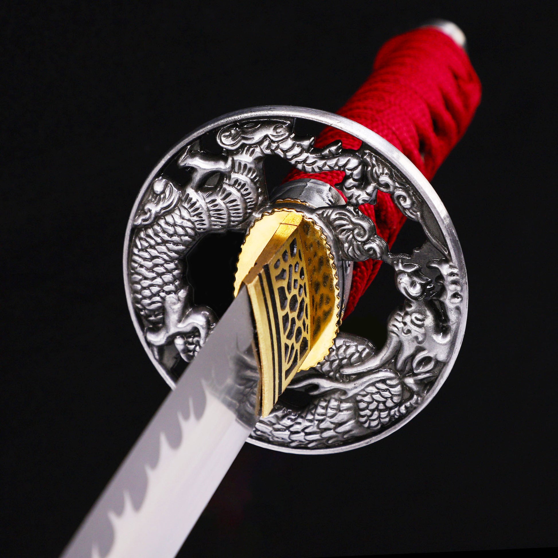 Red handle blood splatter tanto tsuba close-up - hand guard and habaki detail