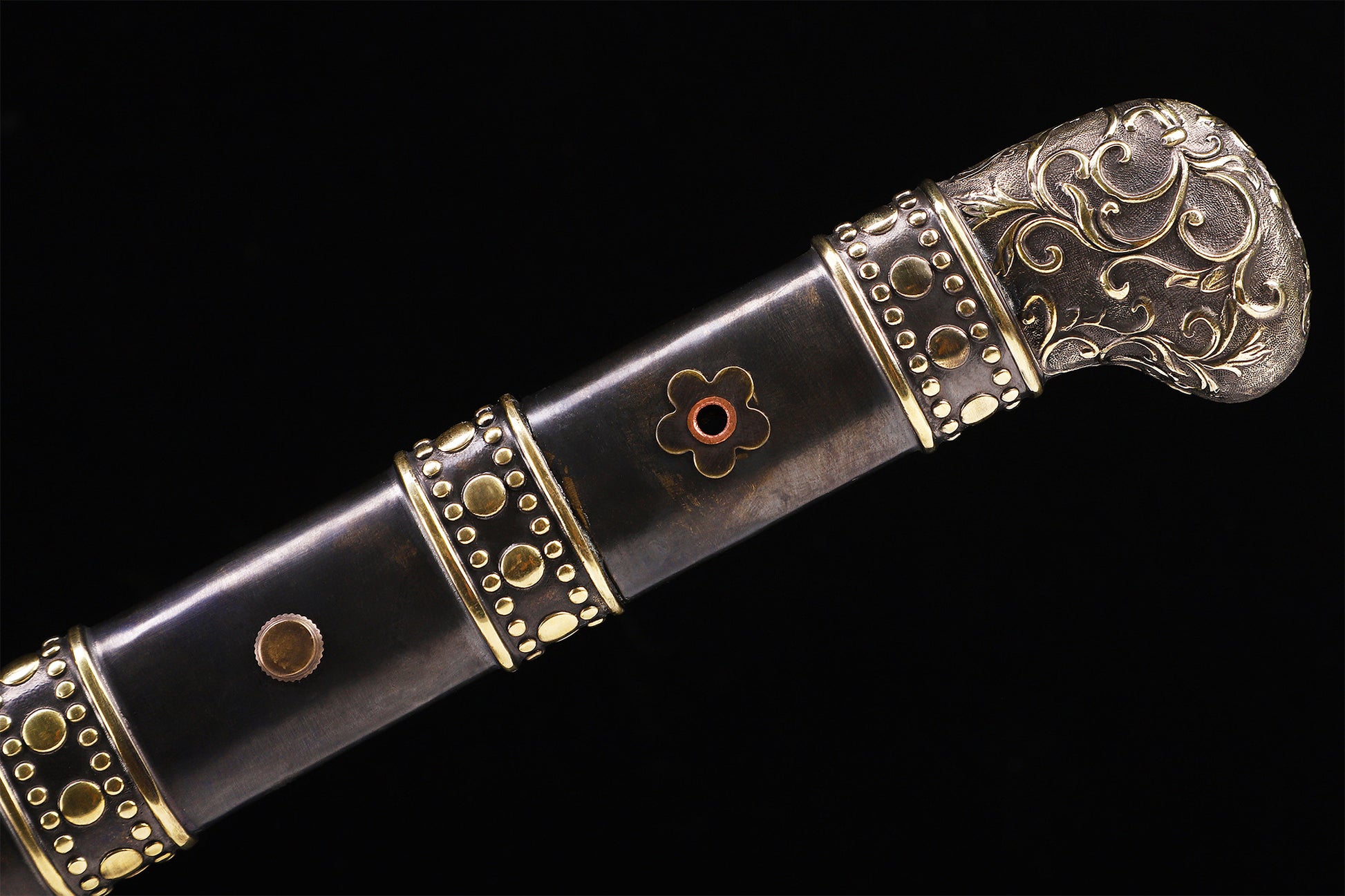Dragon phoenix Chinese sword handle close-up - cloud engraved copper pommel and grip