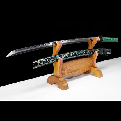 Green handle floral katana angled view - blade curvature and floral pattern saya