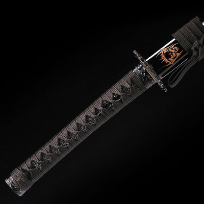 Black Dragon katana handle close-up - black tsuka wrap with dragon design