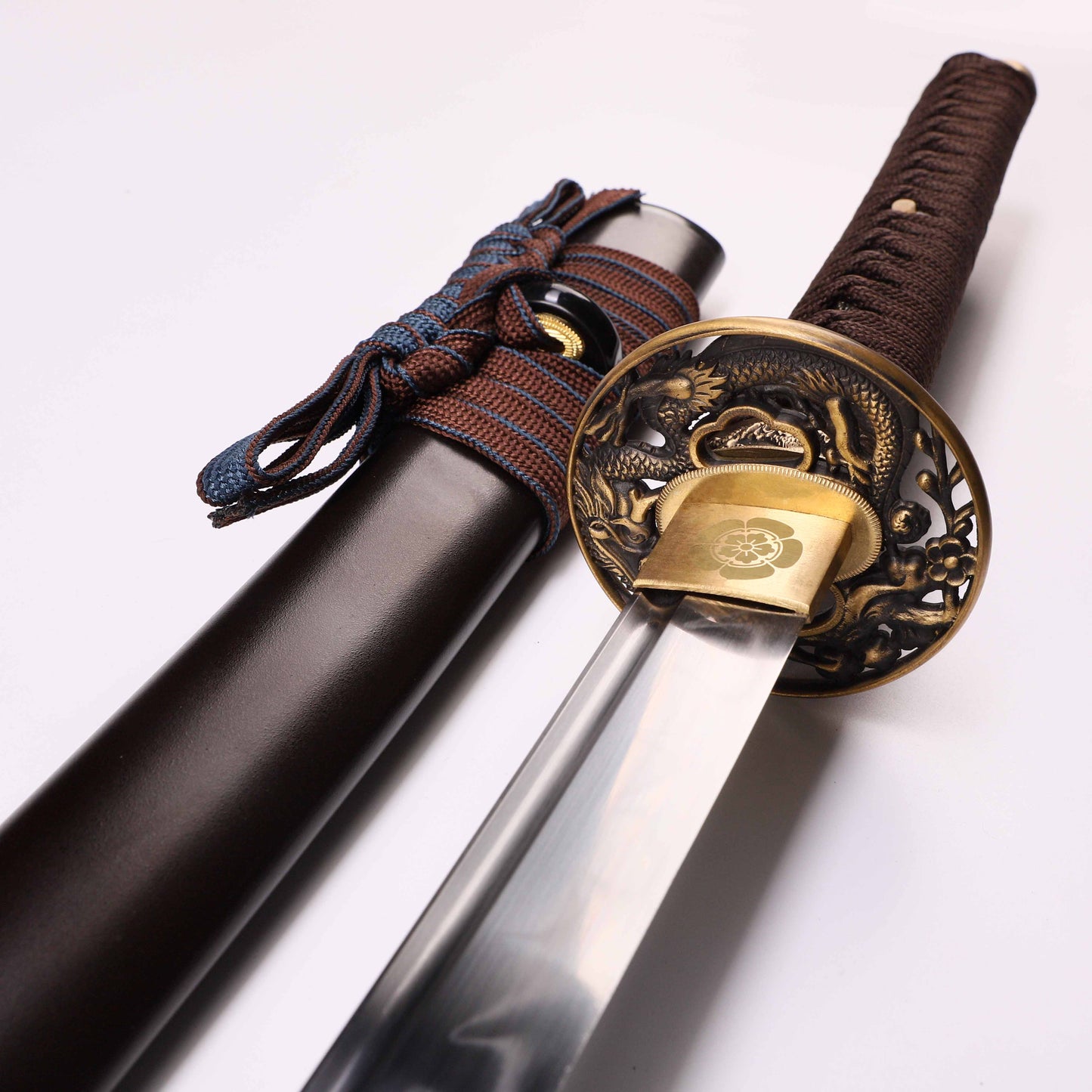 Katana sword tsuba guard detail - decorative hand guard close-up