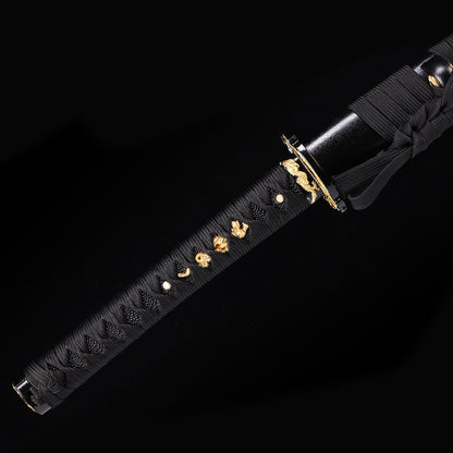 Black Dragon katana handle close-up - black tsuka wrap with dragon design