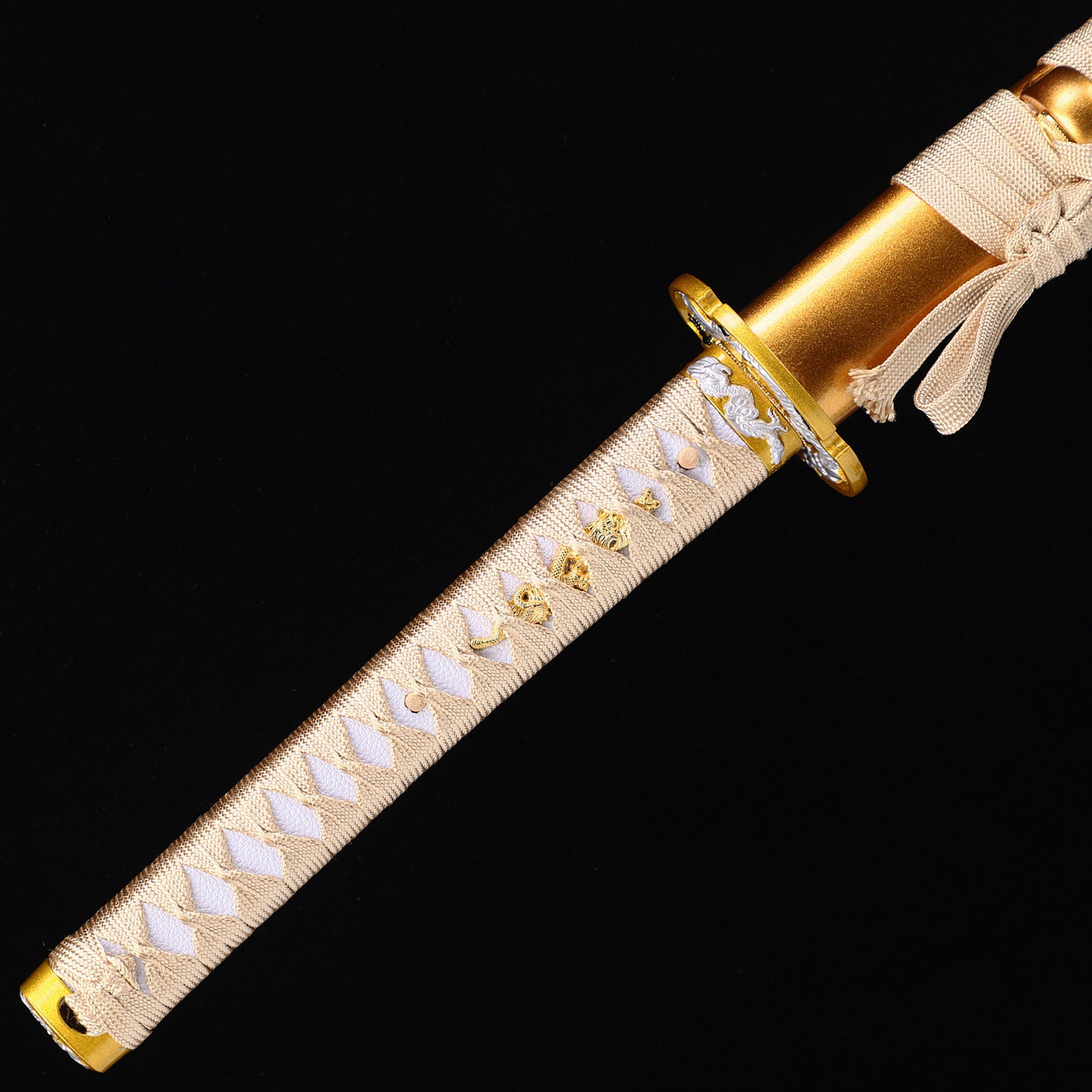 Golden Dragon katana handle close-up - gold tsuka wrap with dragon design