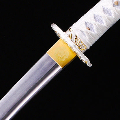 White handle floral tanto blade close-up - razor sharp steel edge and hamon detail