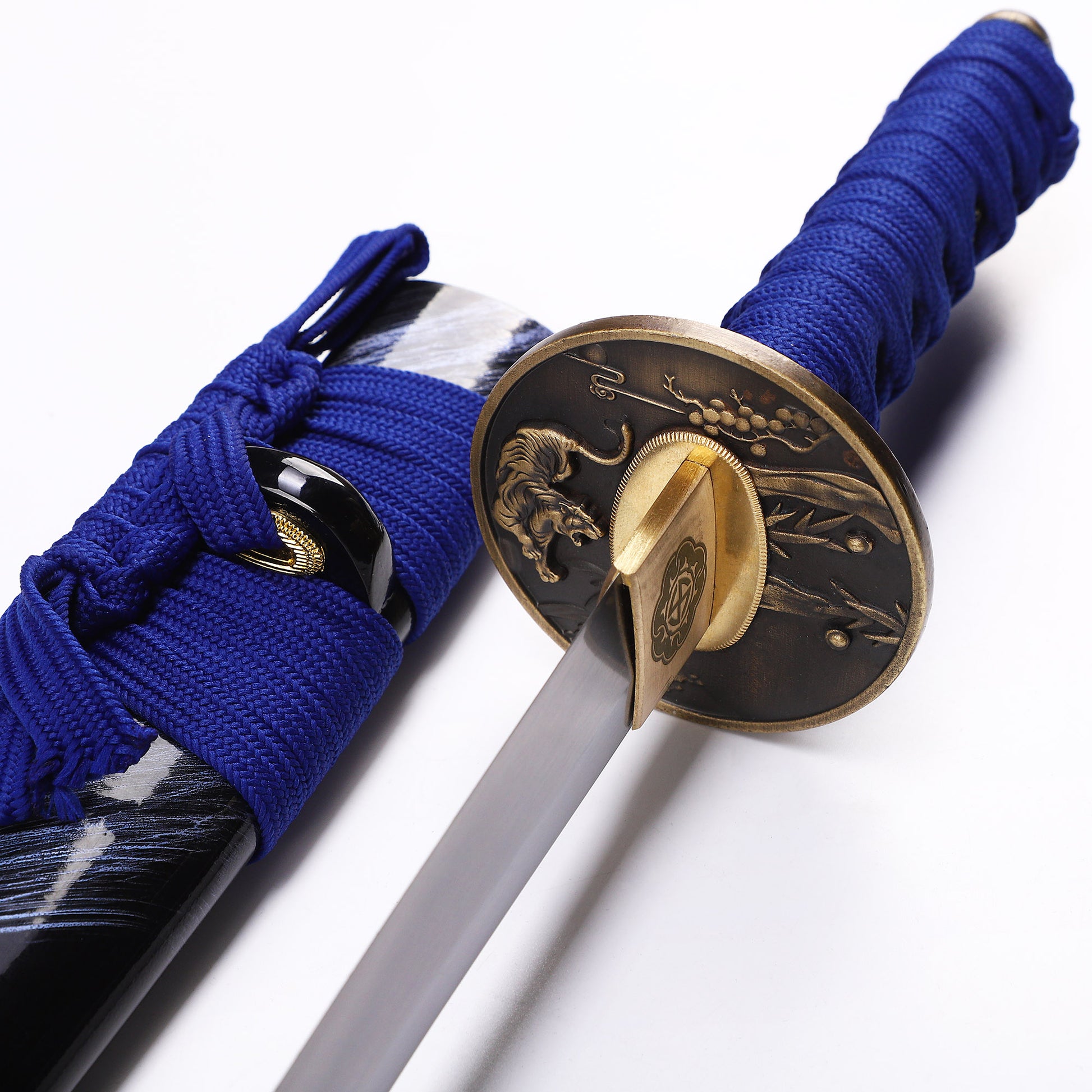 Blue handle black pattern tanto tsuba close-up - hand guard and habaki detail