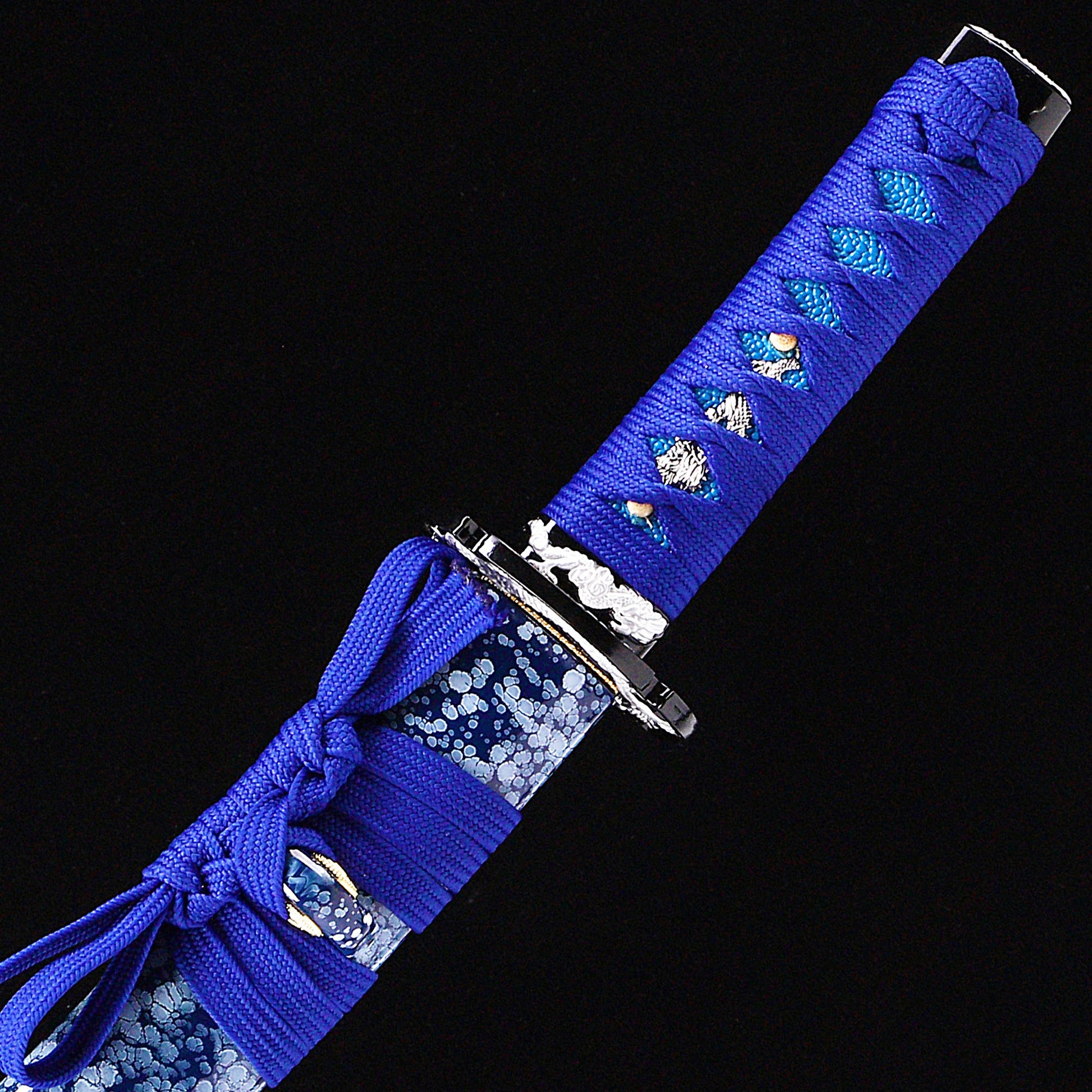 Blue blade dragon etching tanto handle close-up - tsuka wrap and fuchi detail