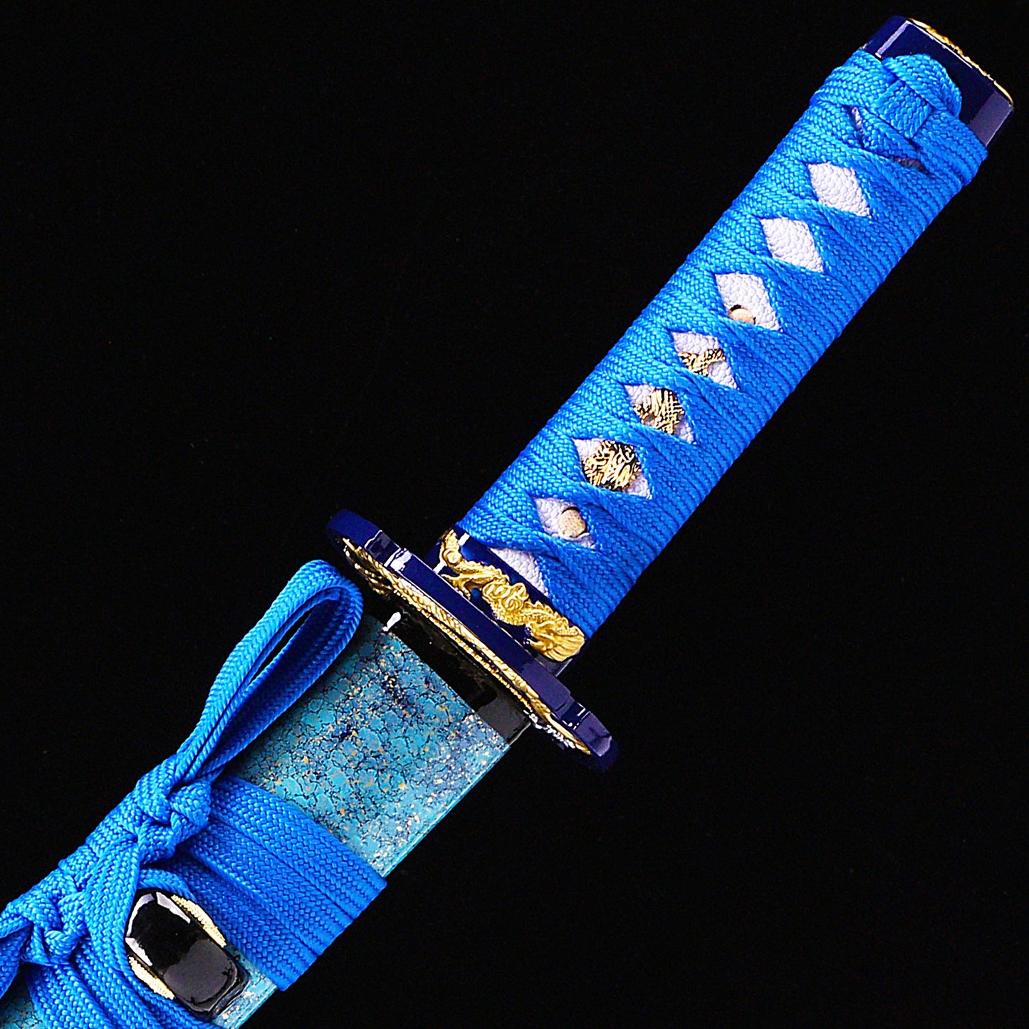 Blue blade wave pattern tanto handle close-up - tsuka wrap with wave fuchi detail