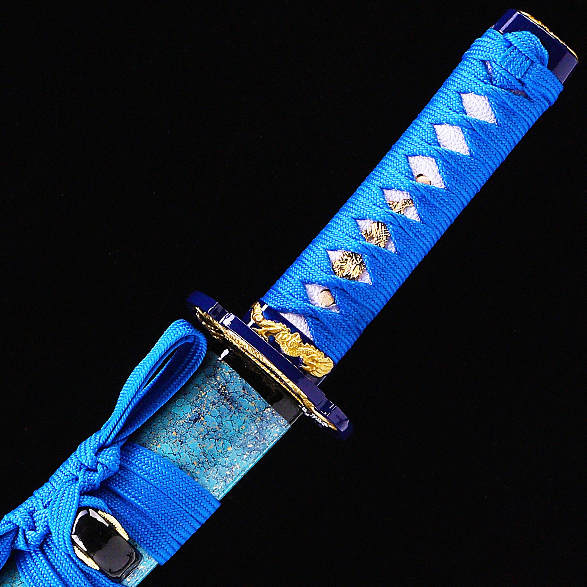 Blue blade wave pattern tanto handle close-up - tsuka wrap with wave fuchi detail
