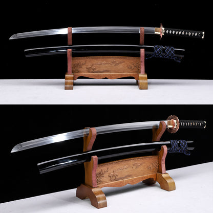 Hammered copper tsuba katana angled view - blade curvature and black saya detail