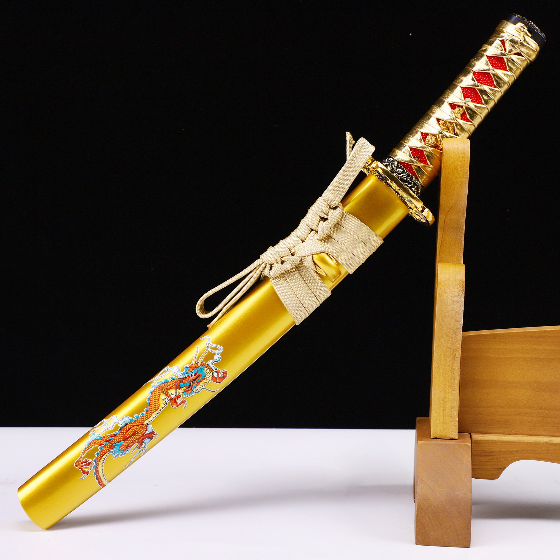Gold handle saya tanto angled view - blade curvature and gold saya contrast