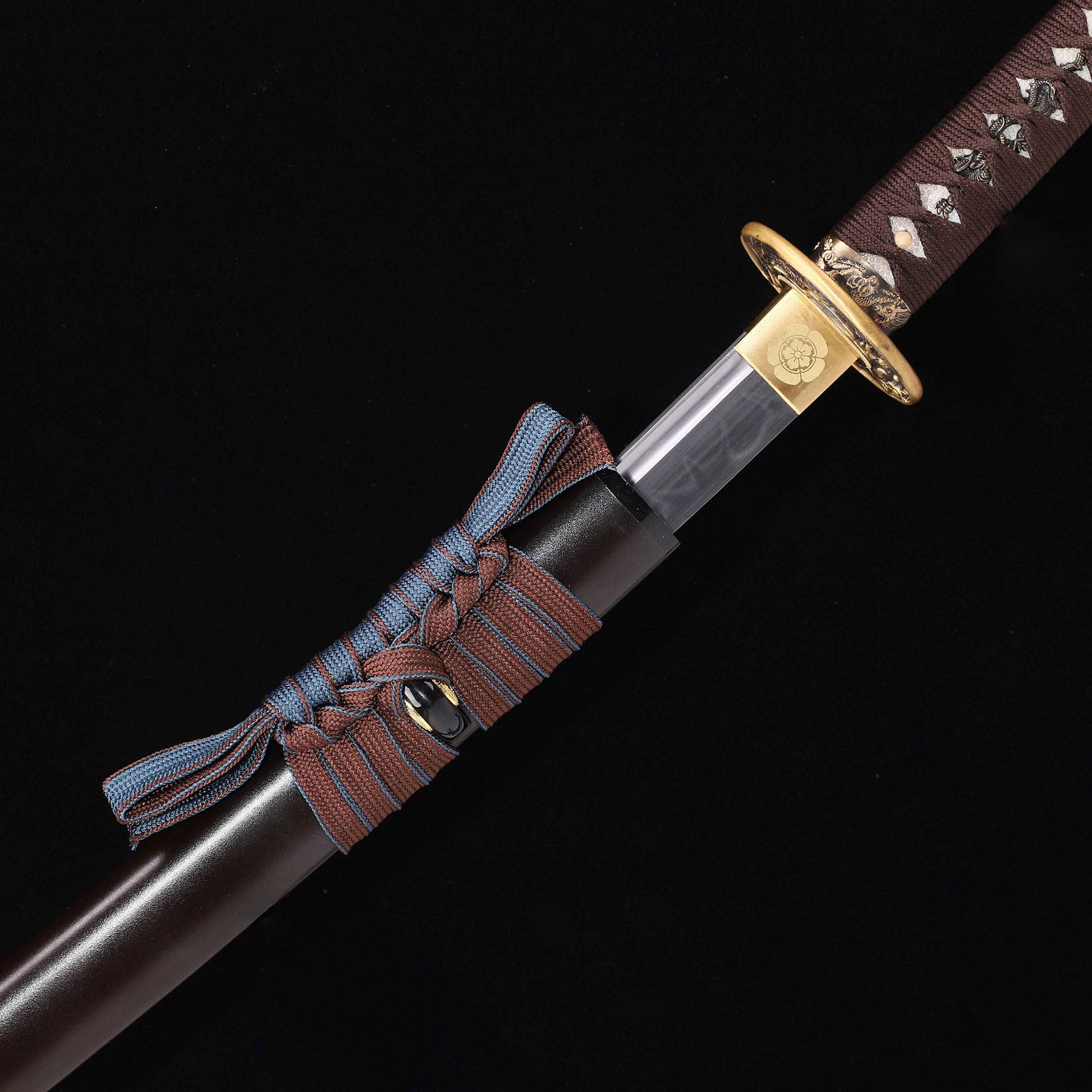 T10 steel katana blade close-up - razor sharp edge and clay tempered hamon detail