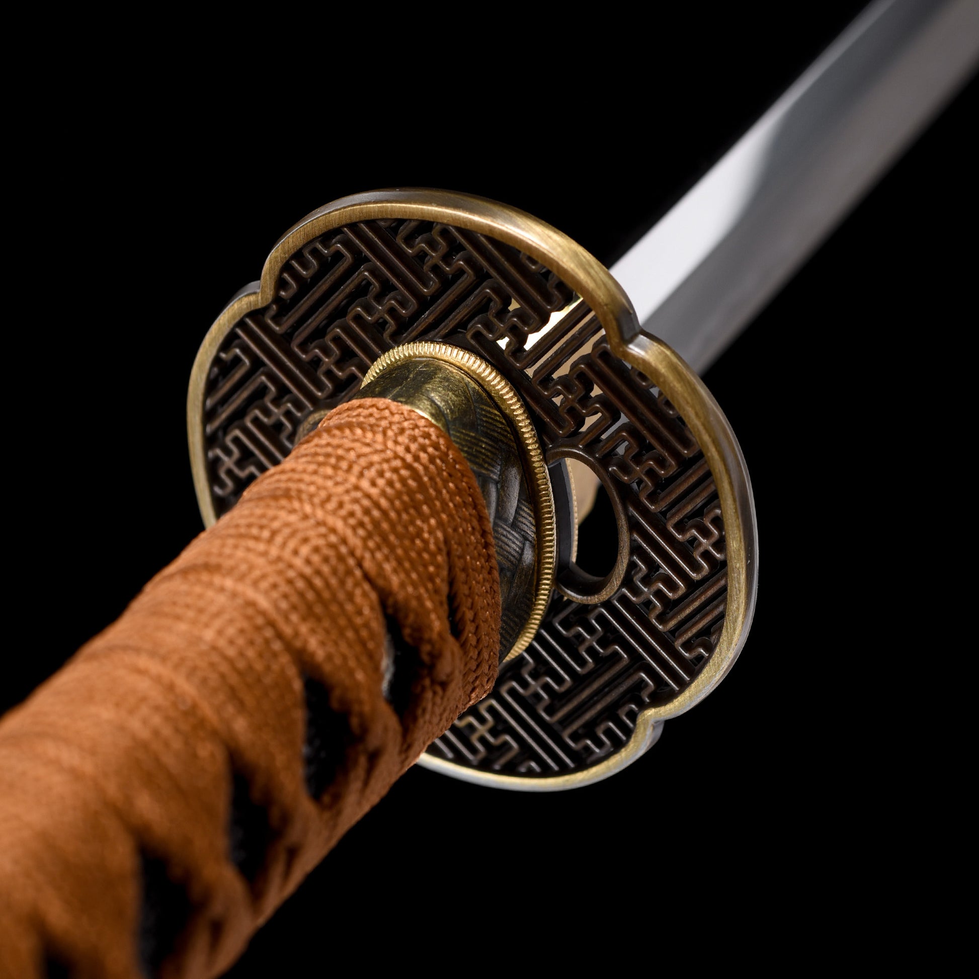 Katana sword tsuba guard detail - decorative hand guard close-up