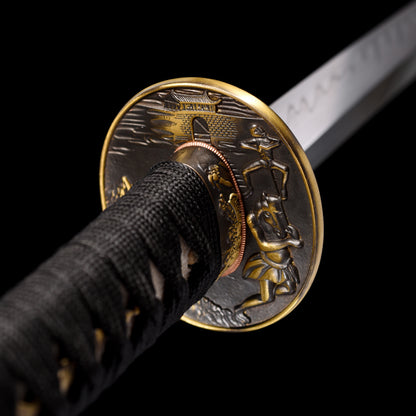 Katana sword tsuba guard detail - decorative hand guard close-up