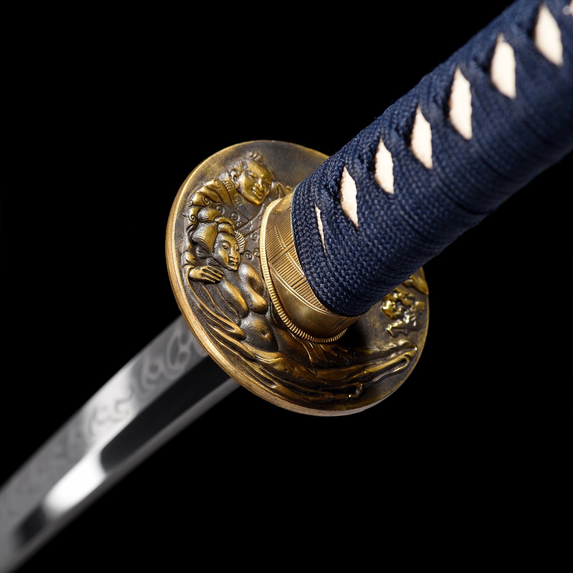 Katana sword tsuba guard detail - decorative hand guard close-up