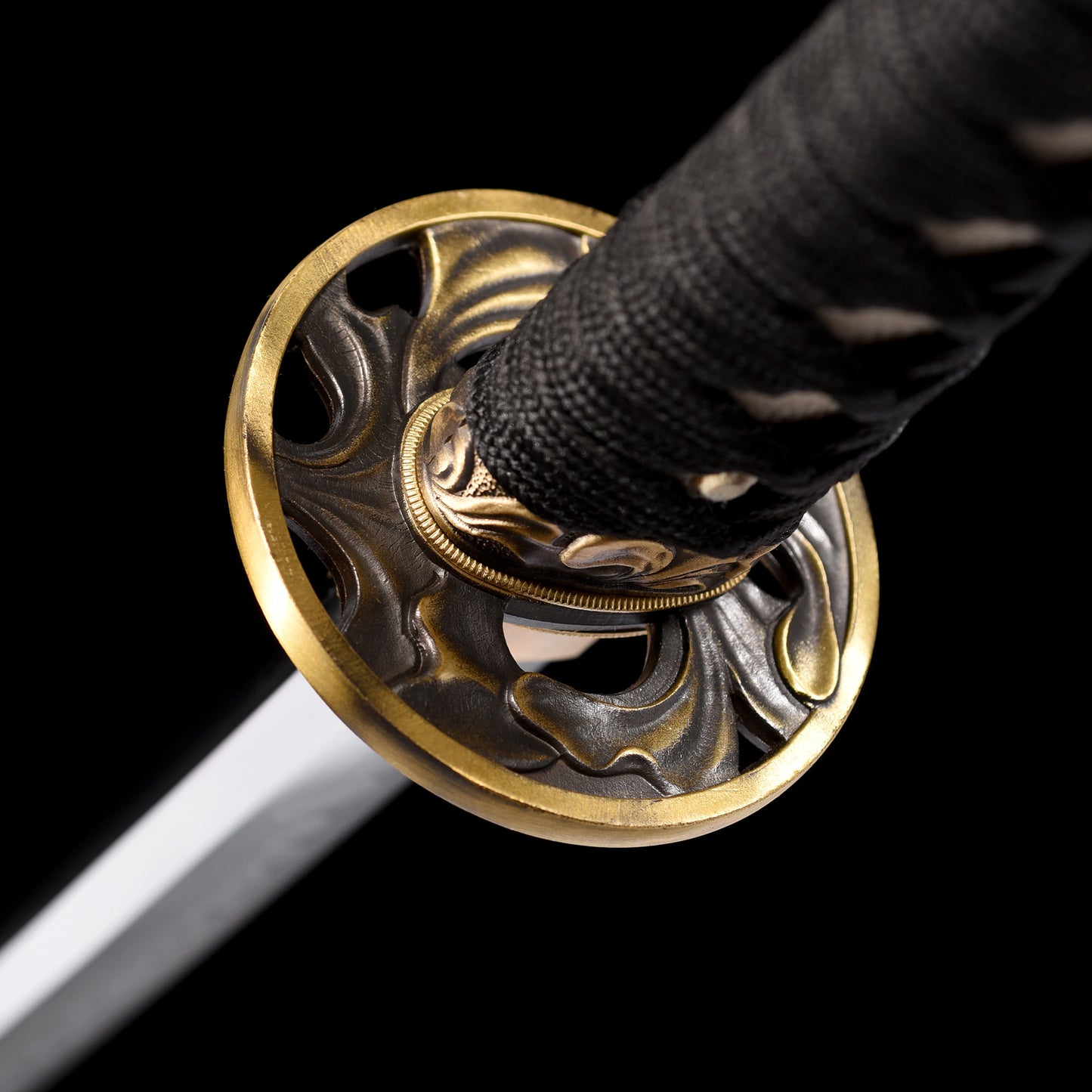 Katana sword tsuba guard detail - decorative hand guard close-up