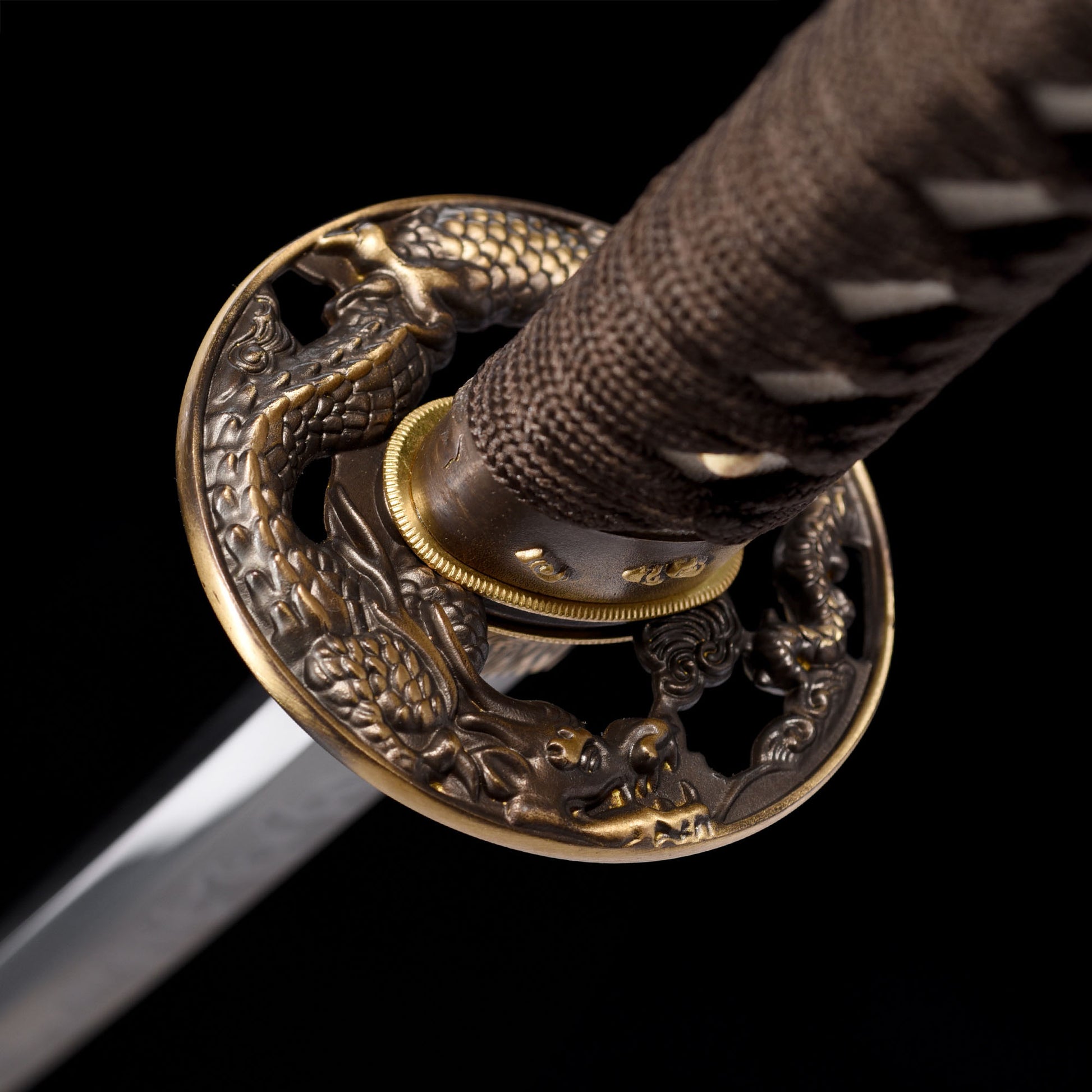 Katana sword tsuba guard detail - decorative hand guard close-up