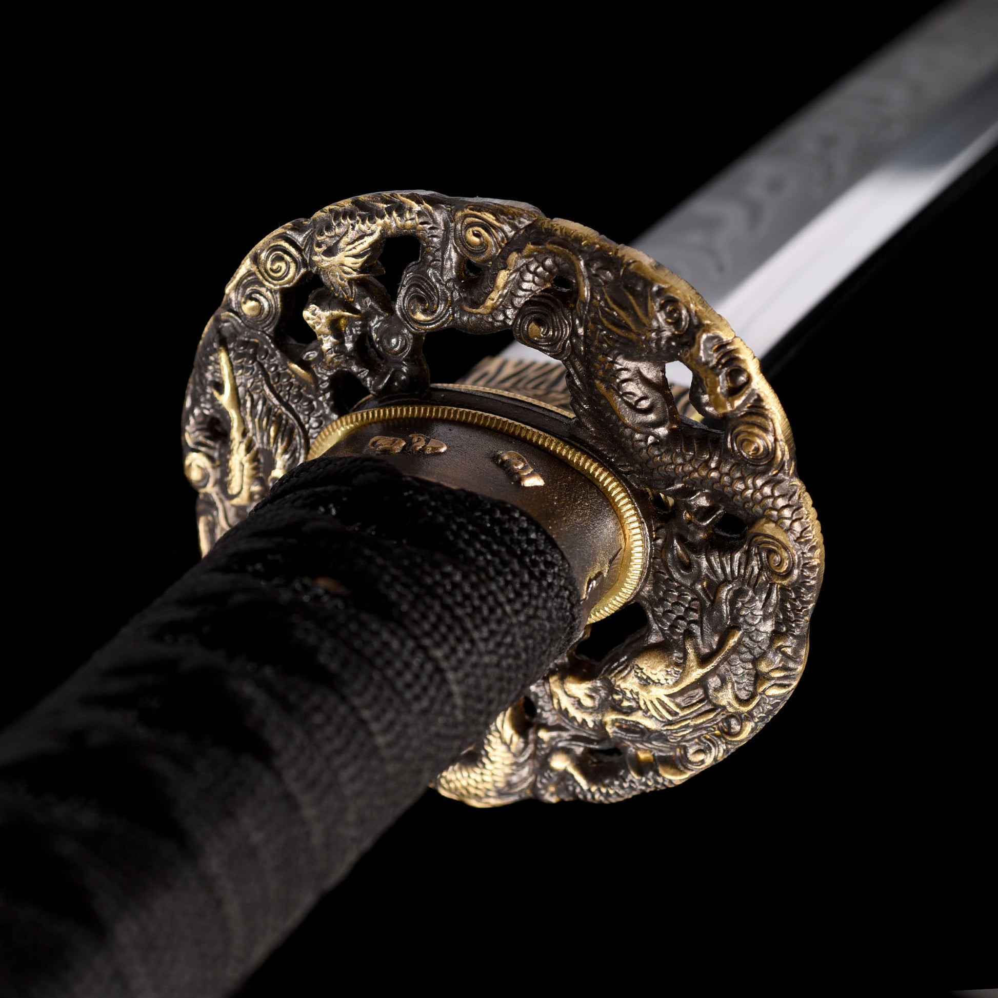 Katana sword tsuba guard detail - decorative hand guard close-up
