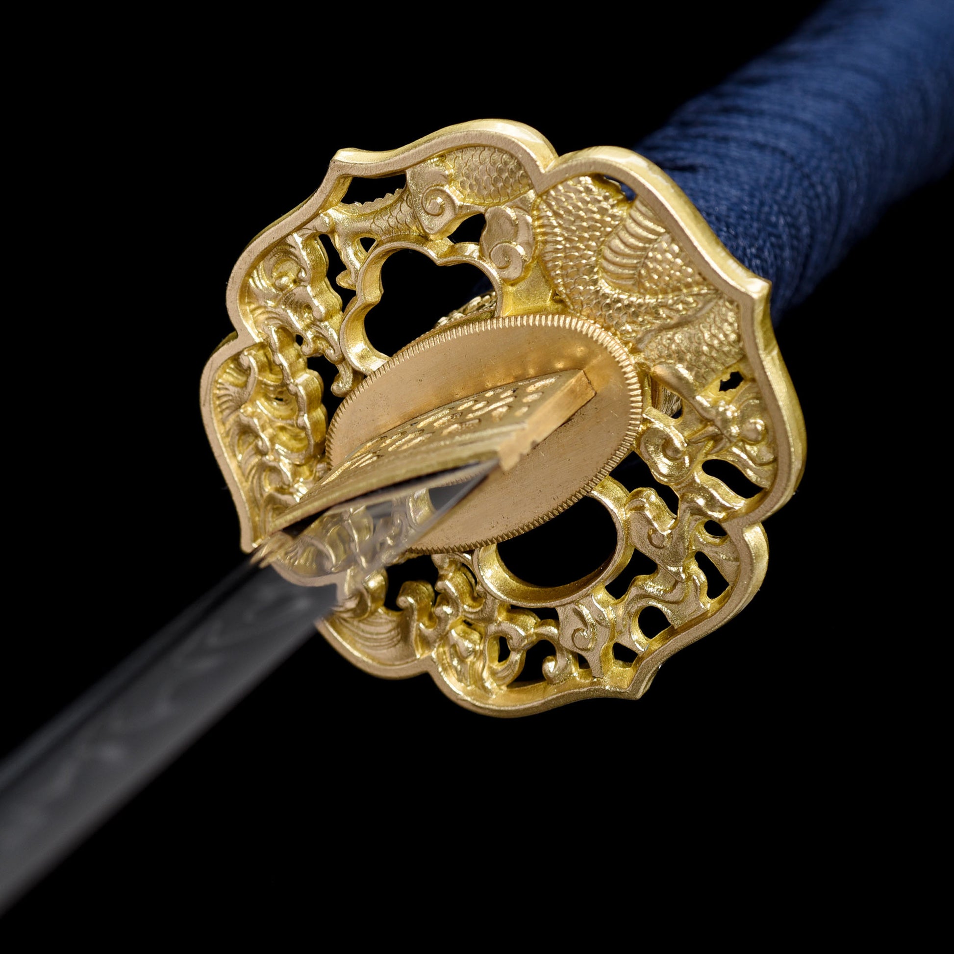 Katana sword tsuba guard detail - decorative hand guard close-up