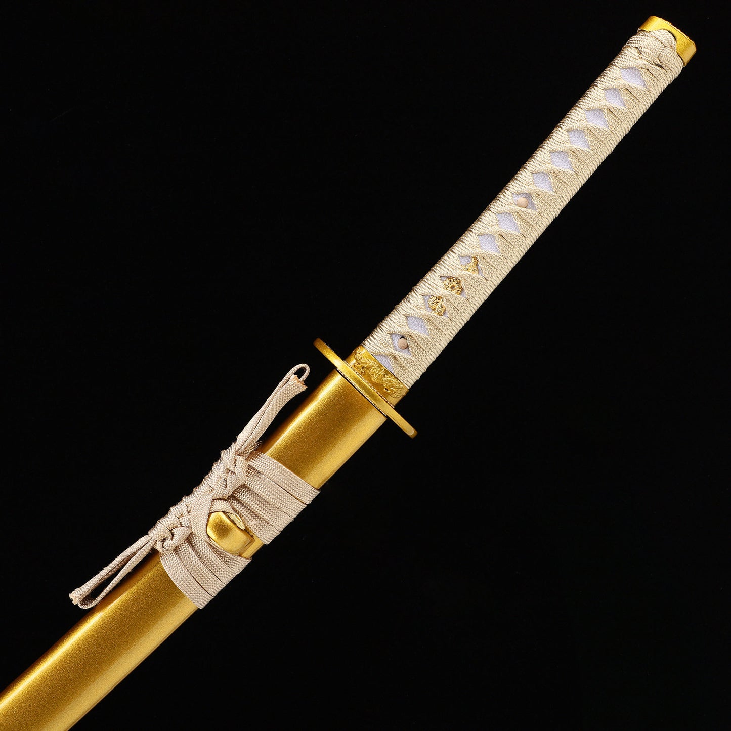 Golden Dragon katana handle close-up - gold tsuka wrap with dragon design