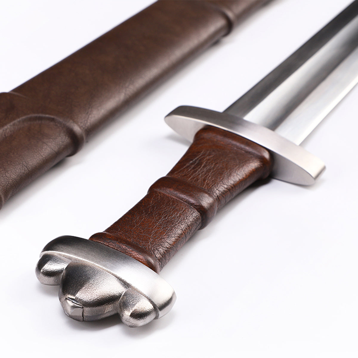 Viking sword handle close-up - wood grip with leather wrap and pommel