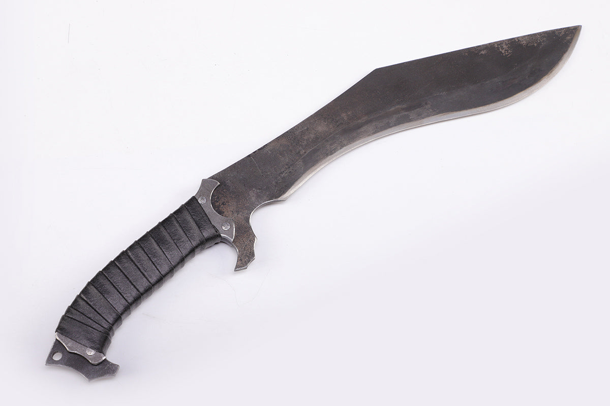 Nepalese curved kukri knife with wooden handle - Slant view with the tip of the knife facing upwards