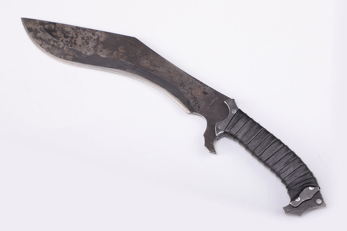 Nepalese curved kukri knife with wooden handle - Left angled view of the blade tip